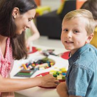 teacher-playing-with-kindergarten-kid